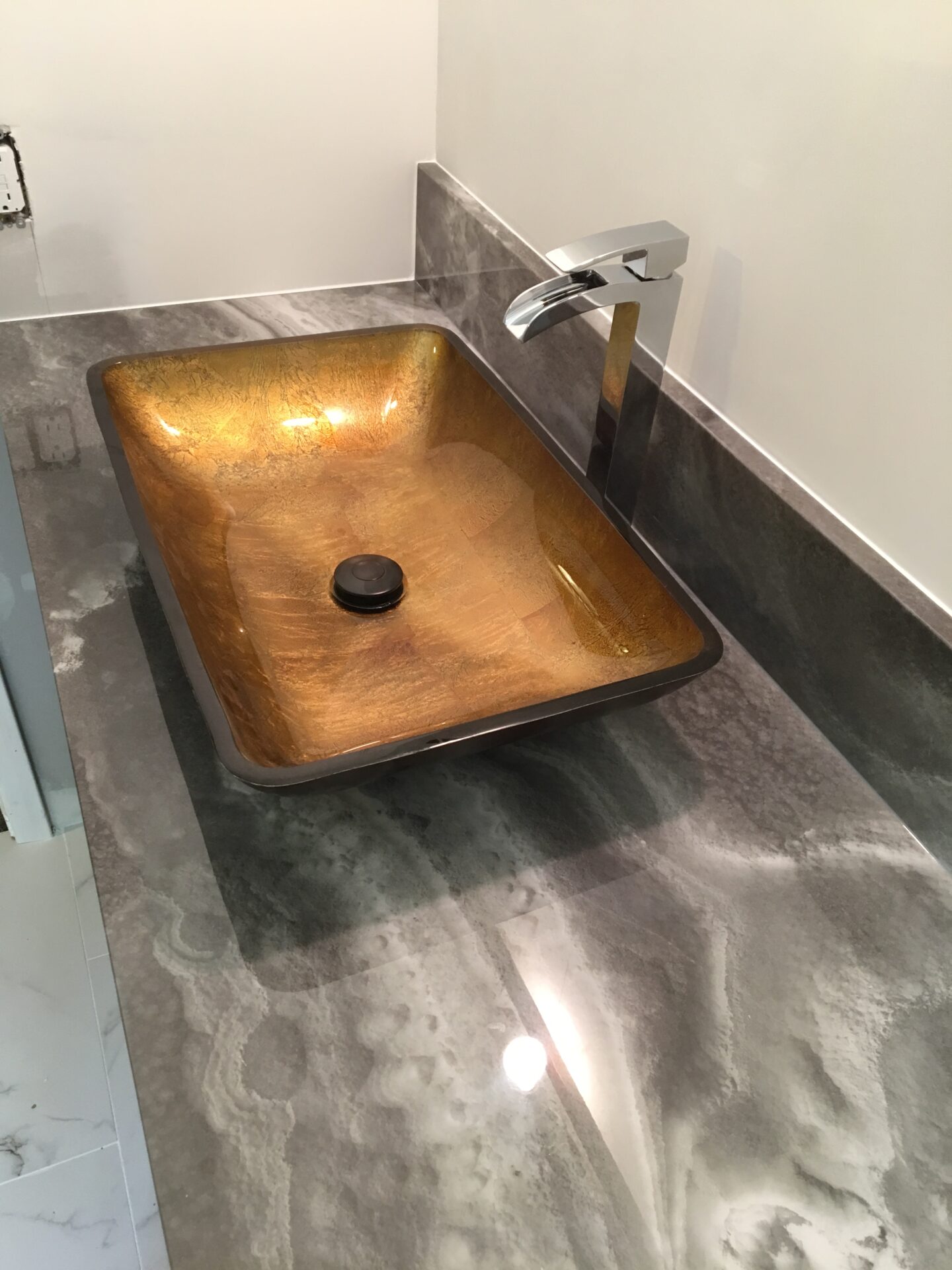 AMI Gold Sink on Tyvarian Vanity Top. Custom Bath Surfaces from American Marble Industries in Canton, OH.