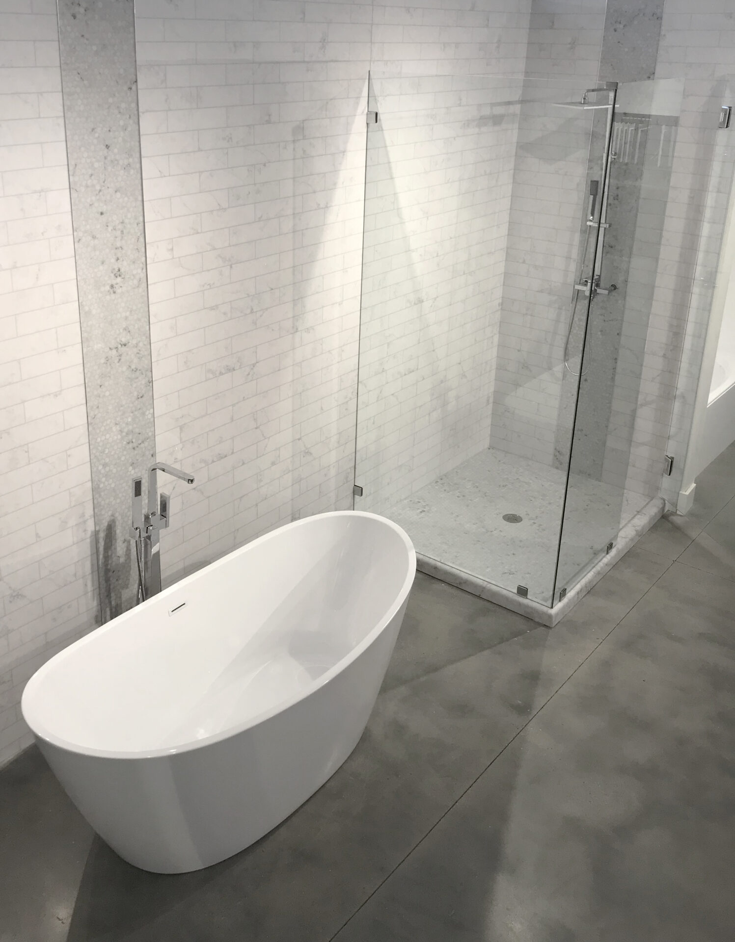 Milano Subway Tile alternative with grout free bathroom and bathtub from AMI in Canton, Ohio.