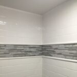 Subway bathroom shower wall tile with Tyvarian inlay available from AMI in Canton, Ohio.