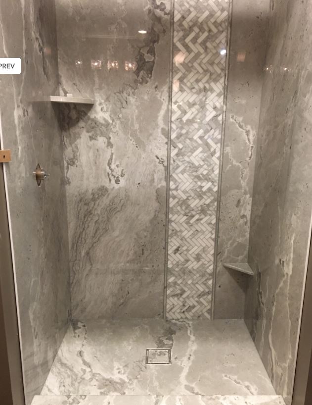 TYVARIAN STONECASTLE Shower with Inlay. Let AMI customize your bathroom with grout free tile alternatives manufactured and fabricated in Canton, Ohio.