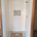 Tyvarian Hexagon Inlay in Subway Tile Shower - All 100% grout free and available from AMI in Canton, Ohio.