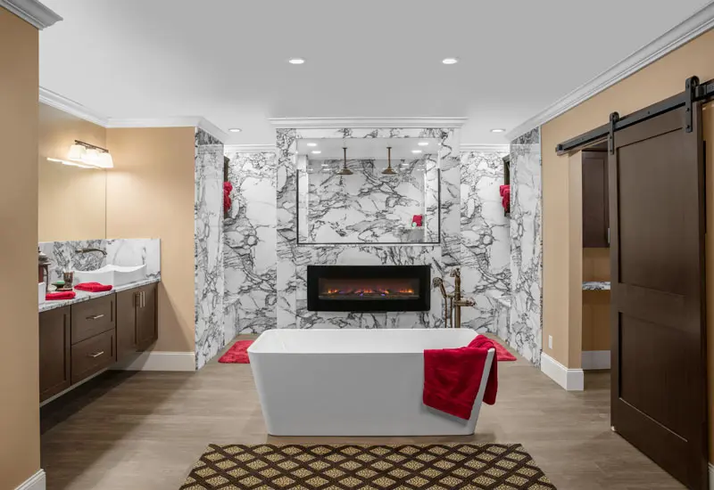 AMI in Canton, Ohio creates amazing grout free bathrooms like this using solid surface, cultured marble and Tyvarian products designed to be beautiful, easy to clean and leak free.